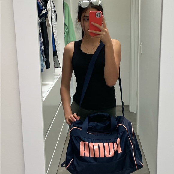 A navy blue and baby pink Puma duffel bag. - Picture 7 of 7